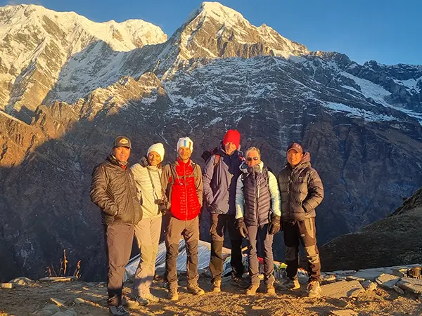 Group photo with mountains on the background